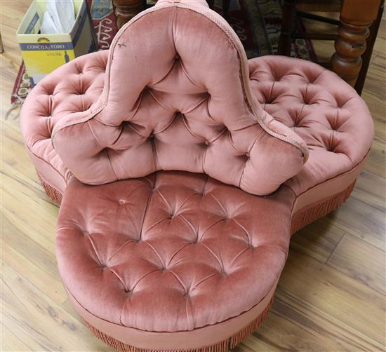 A Victorian pink dralon upholstered three seat conversation settee